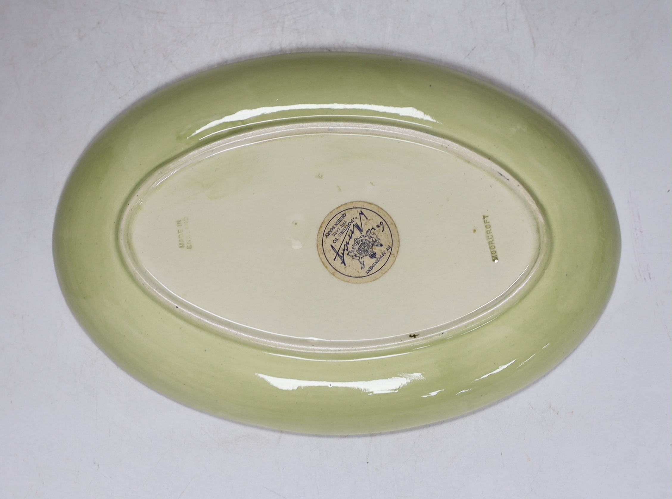 A Moorcroft oval ‘Pansy’ dish, stamp and label to the base, 23cm wide
